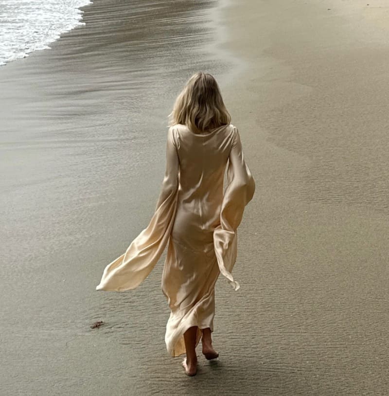 Babe in long dress on beach