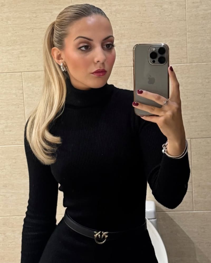 Sexy blonde in black tight outfit