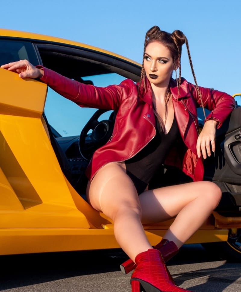 Babe in sexy outfit in sportscar