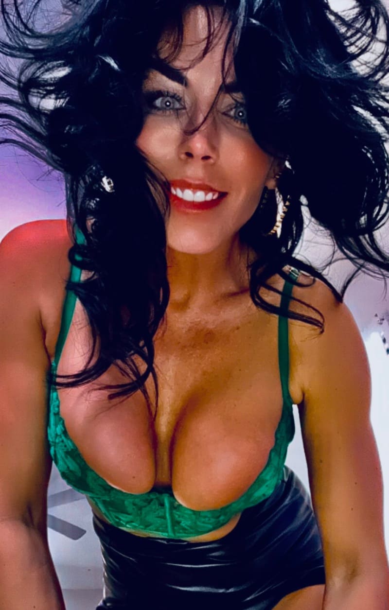 Sexy brunette in green