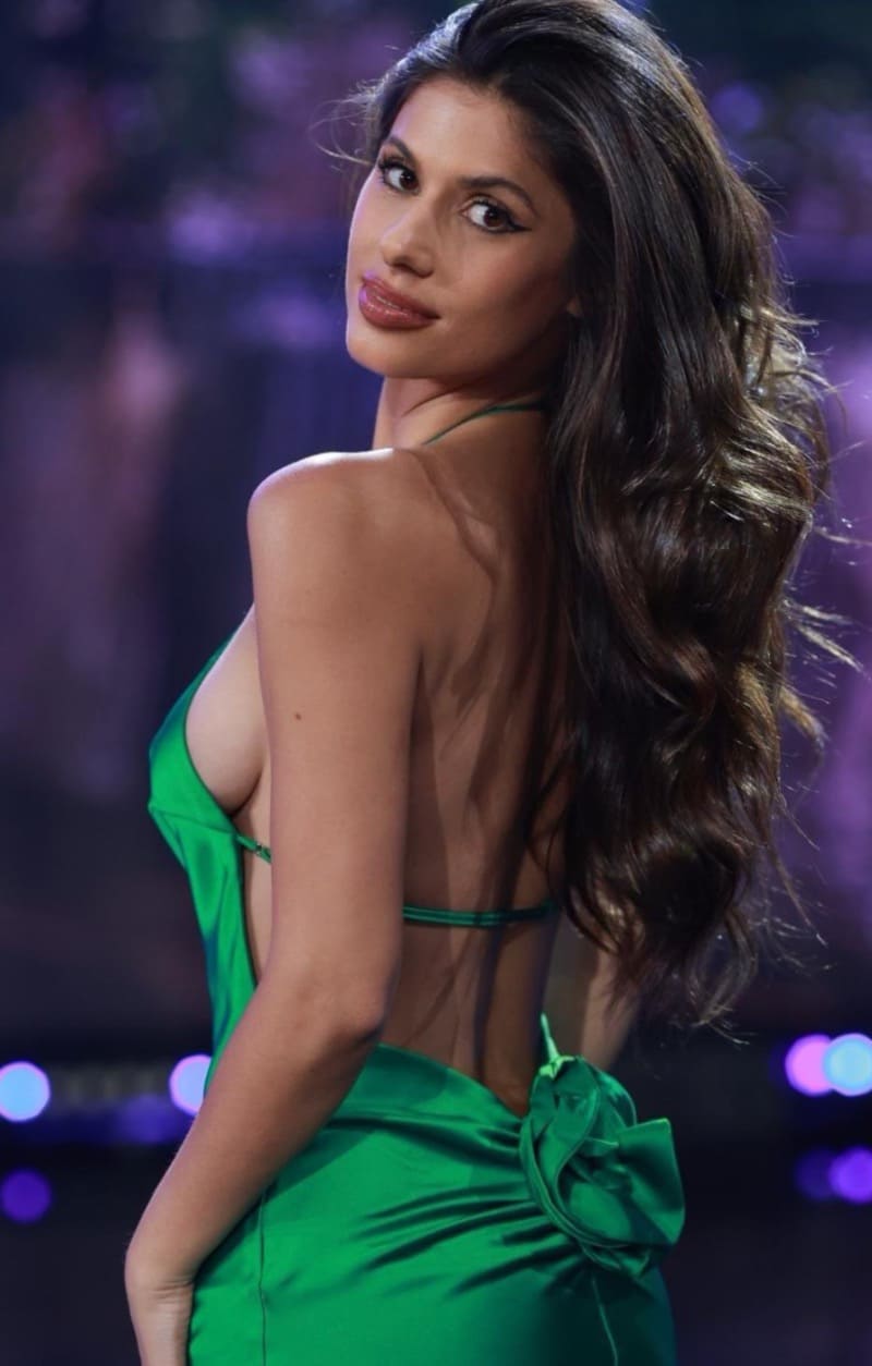 Sexy woman in green tight dress with open back