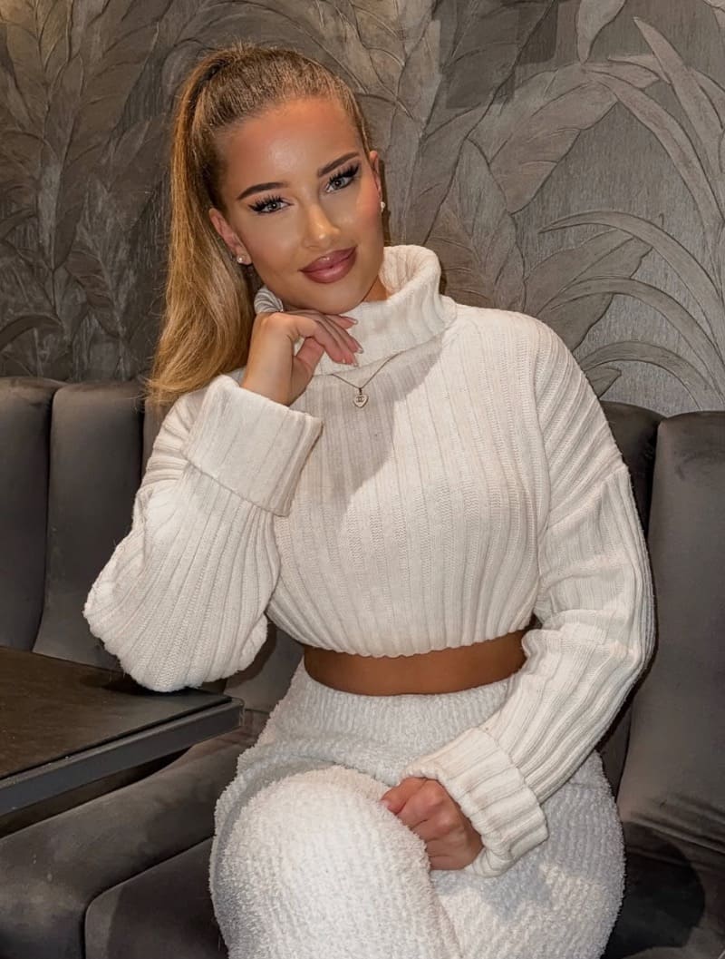 Jacquelina in tight white outfit