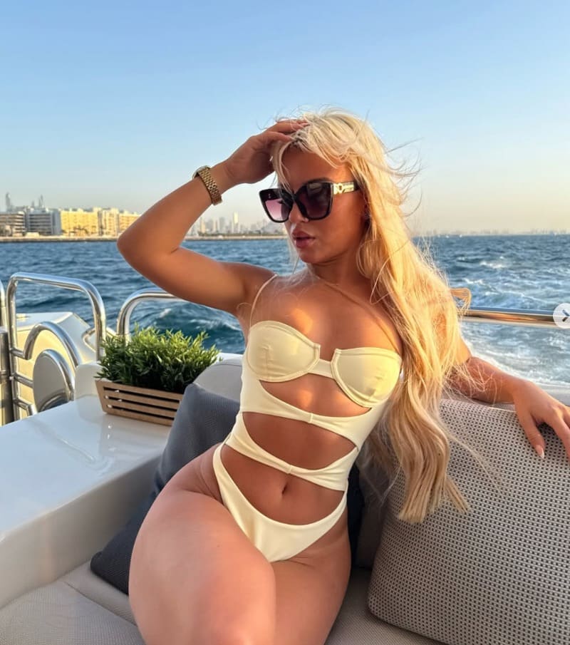 Hot blonde in bikini on boat