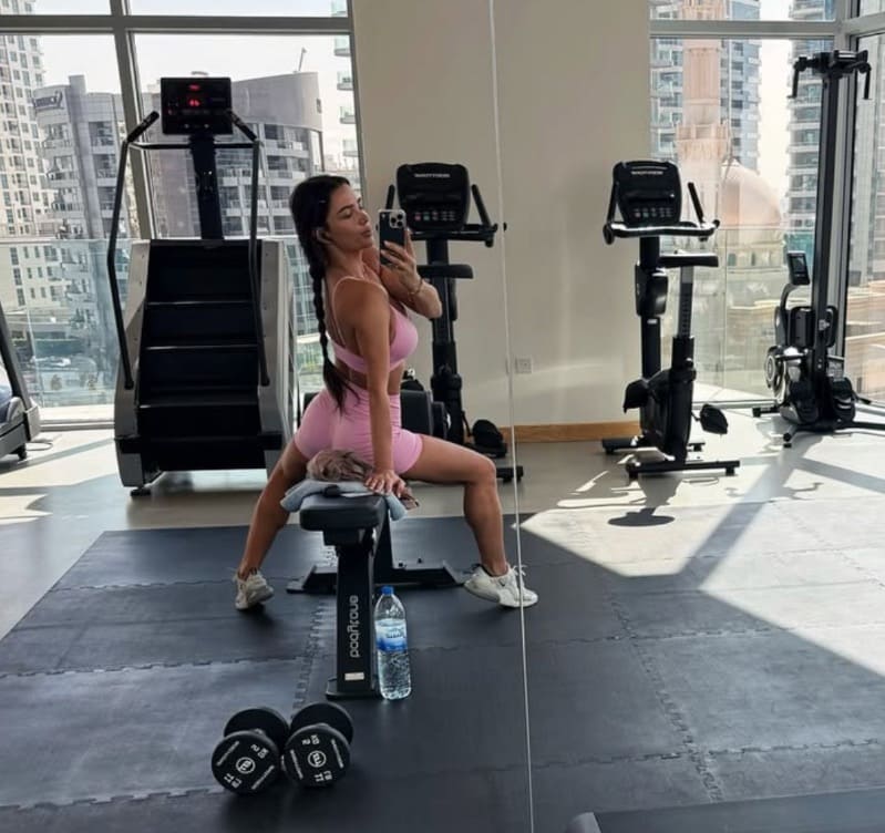 Hot brunette in gym with tight gym clothes on