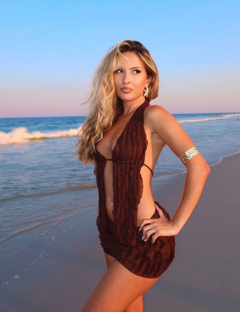 Reem in sexy brown dress