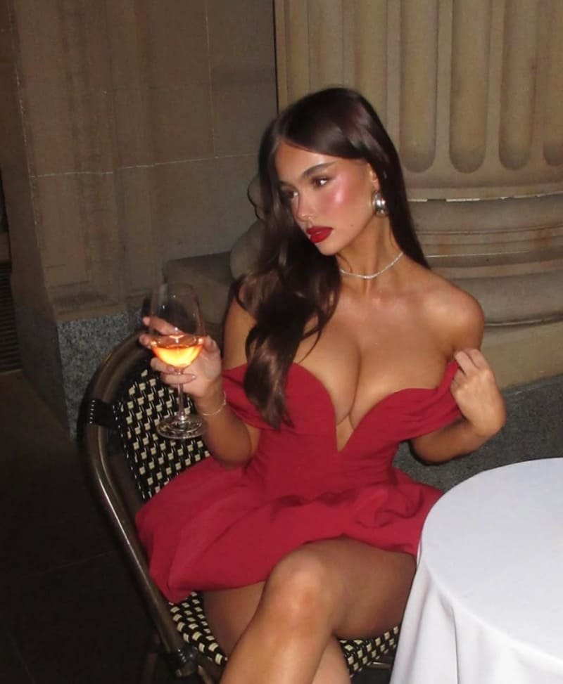 Emily in red dress showing all curves 