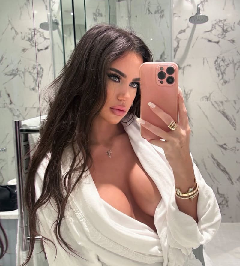 Babe with big tits in white robe