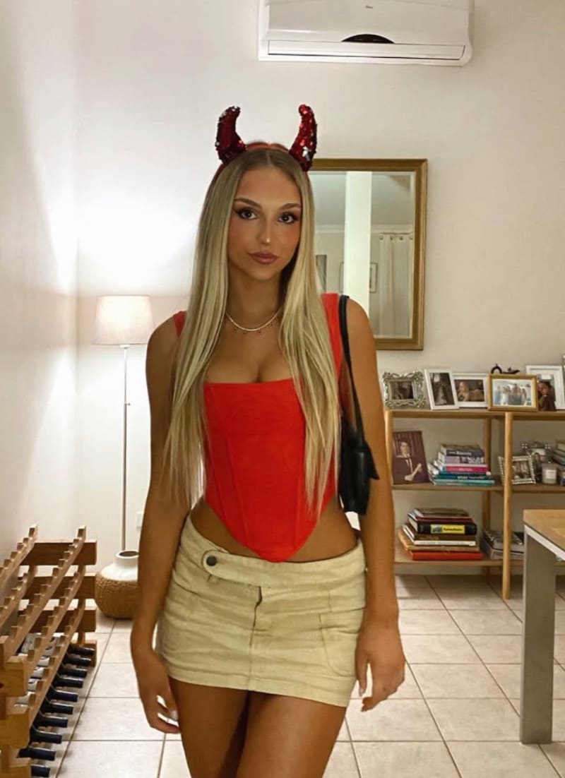 Blonde with devil horns