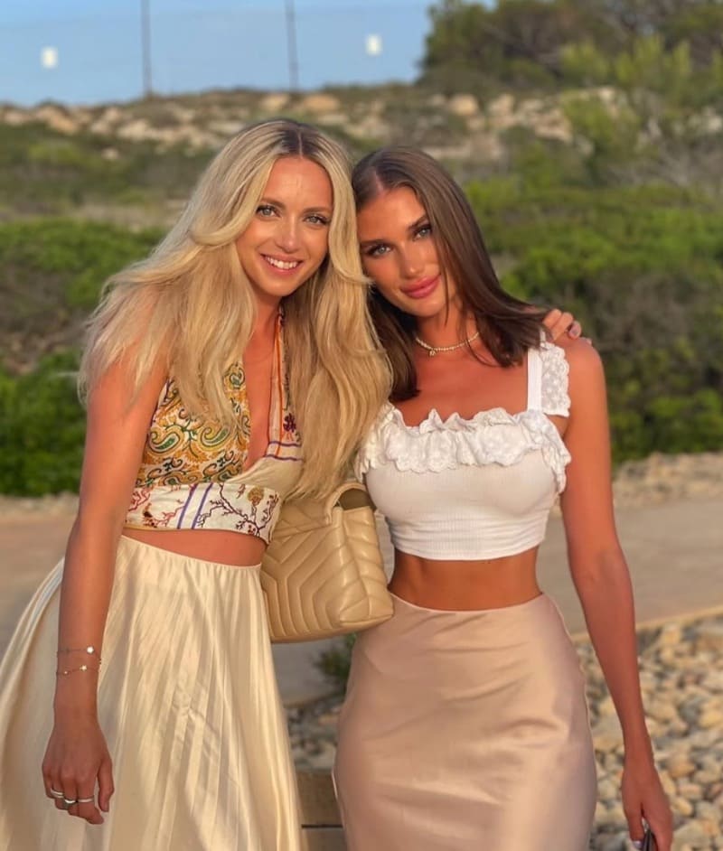 Sexy brunette and blonde in tops