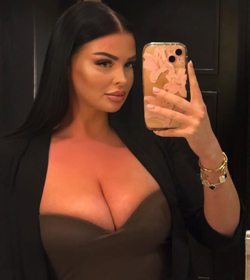 Sexy brunette with massive boobs