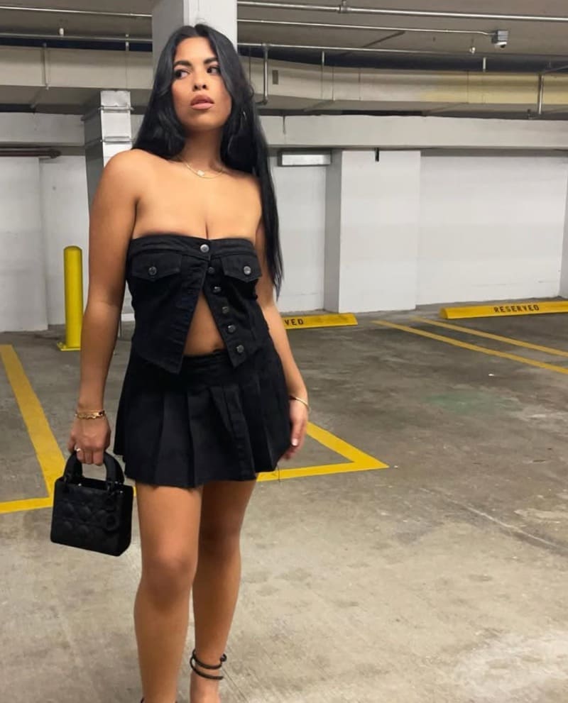 Rakita in black dress