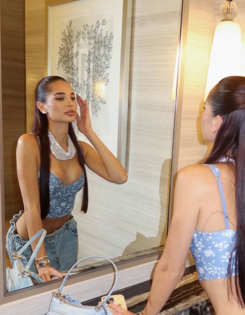 Angelika looking in mirror