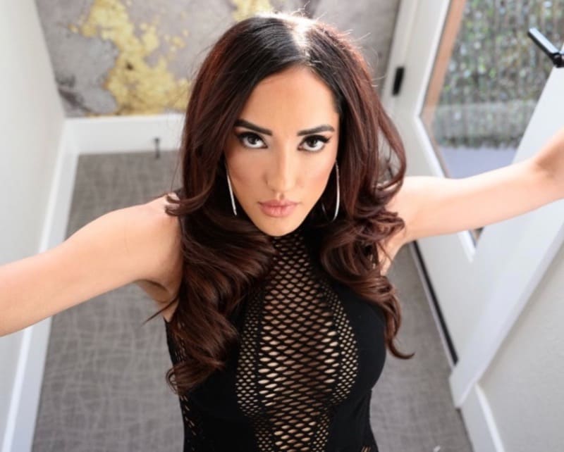 Chloe in black tight dress