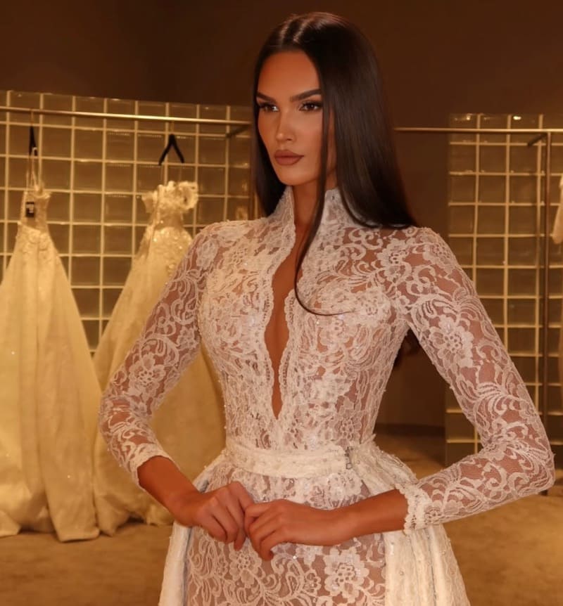 Ema in white wedding dress