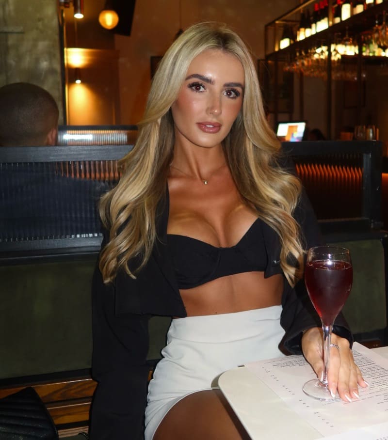 Hot blonde in café in sexy outfit