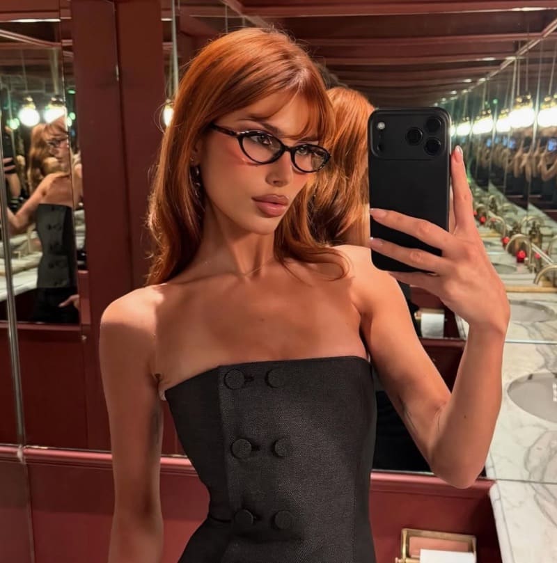 Phoebe in sexy top taking selfie