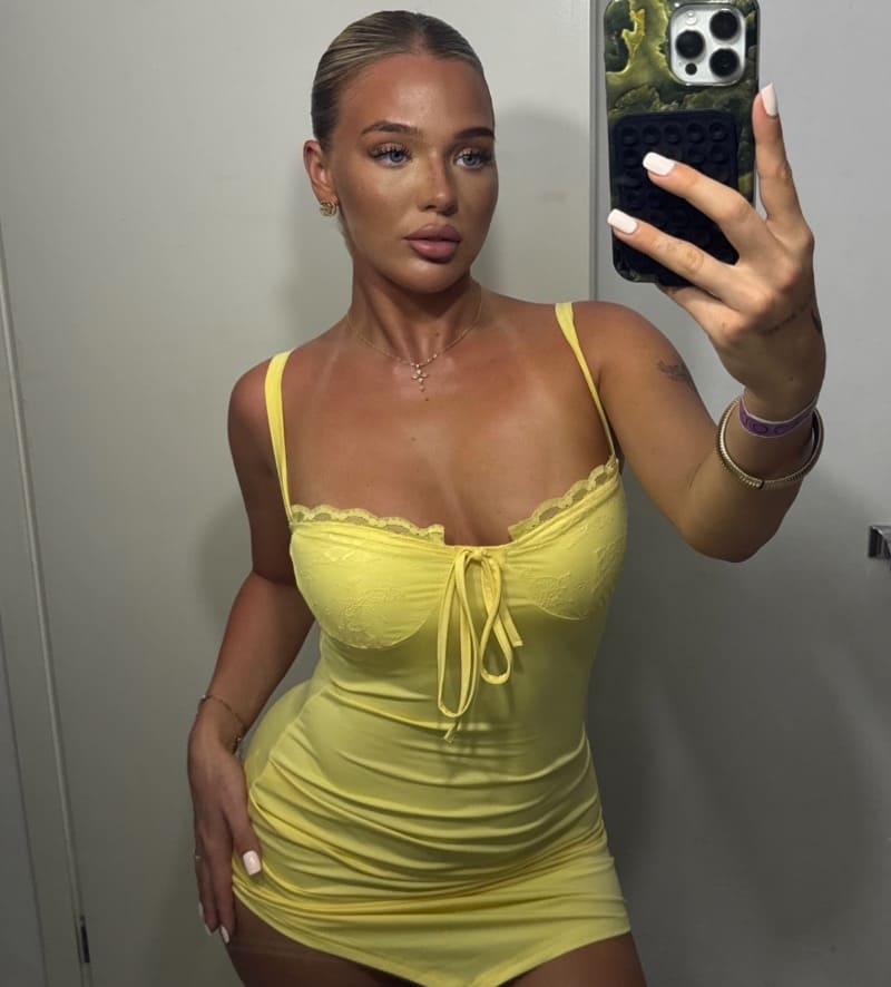 Sexy model in short yellow outfit
