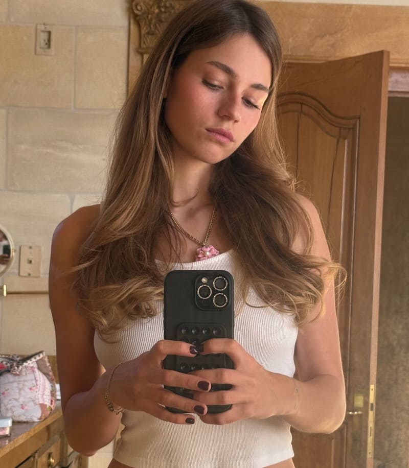 Sexy brunette takes mirror selfie
