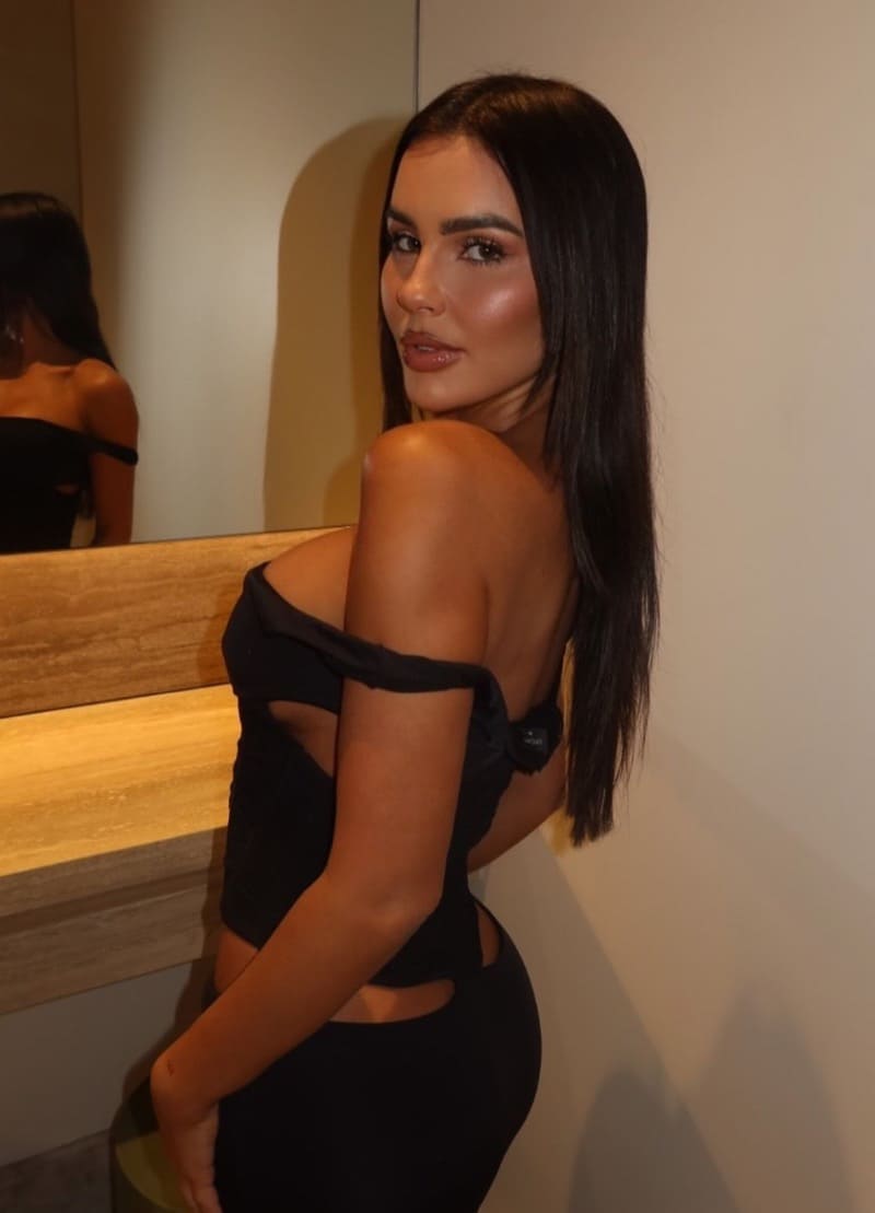 Chrysten in tight black dress