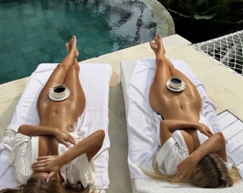 Millie and friend naked on lounge chairs