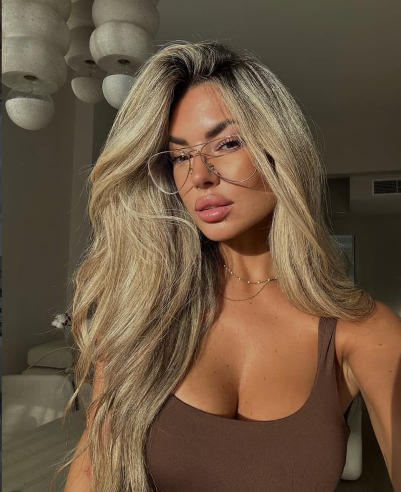 Laura in mini brown top