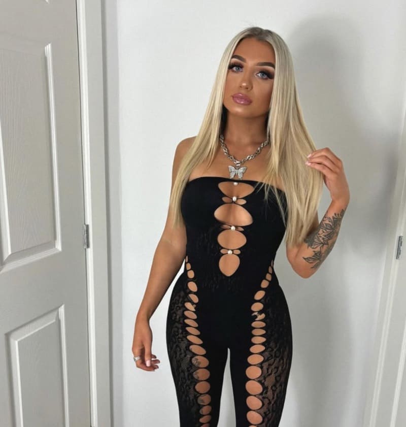 Sexy model in black tight outfit