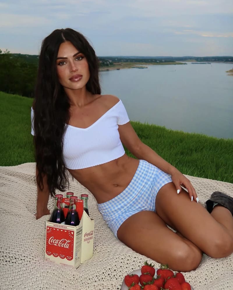 Hot brunette in tight blue pants