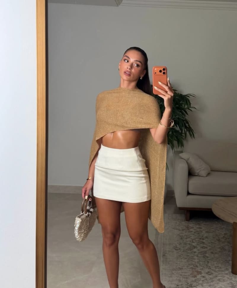 Babe in cool beige top and white skirt