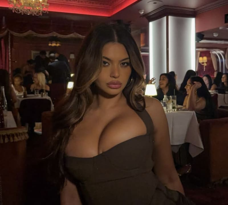 Sofia shows massive tits in tight brown dress