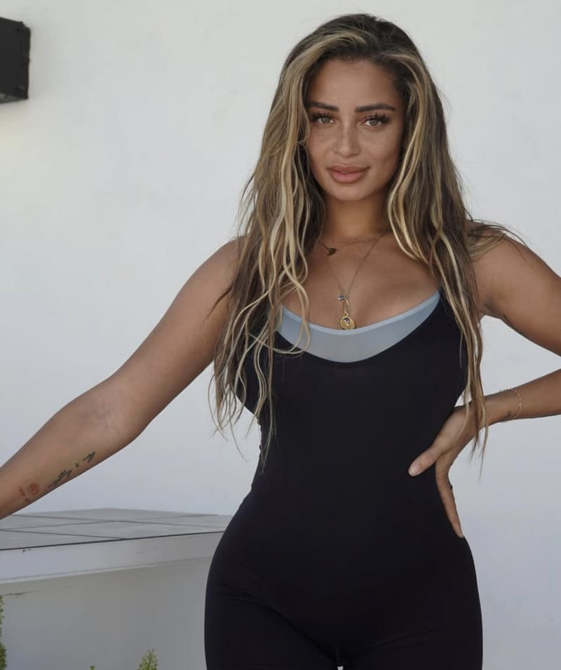 Tori in tight black dress