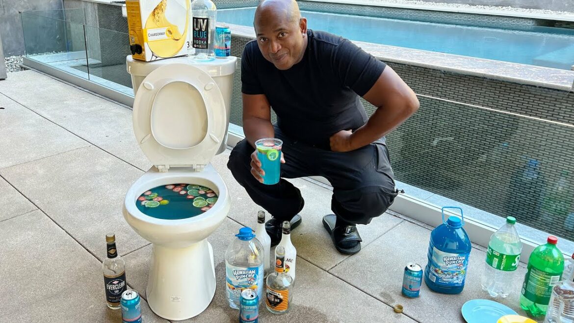 Tipsy Bartender zit naast een gigantische cocktail