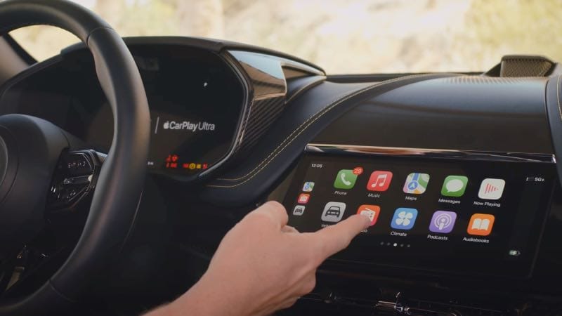 Person touching apple Carplay Ultra