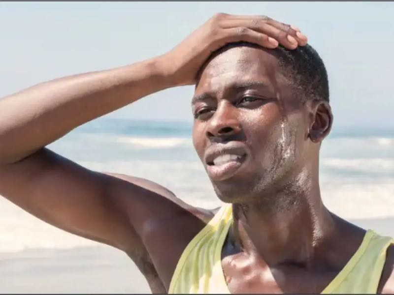 Person sweating on beach